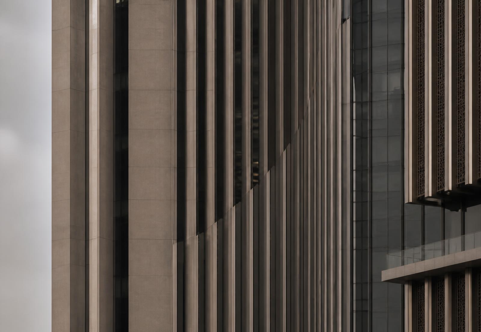 Close study of a contemporary Dubai office tower facade in diffused daylight